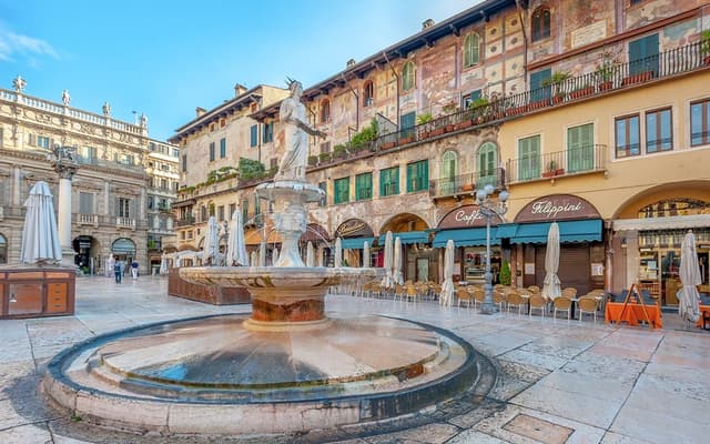 Piazza delle Erbe in Verona with its historic fountain and frescoed market square buildings