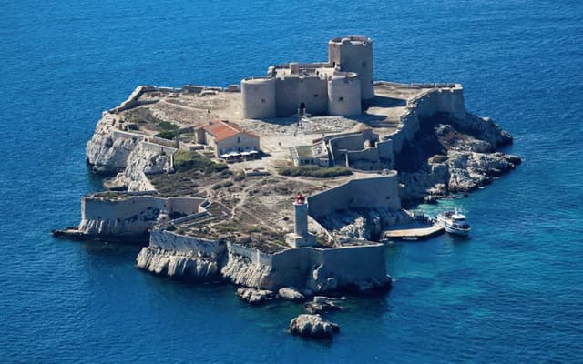 Aerial view of the Chateau d'If island fortress in the blue sea off Marseille