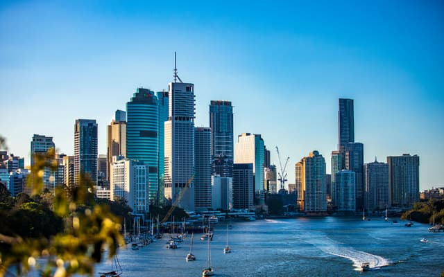city skyline under clear blue sky during daytime