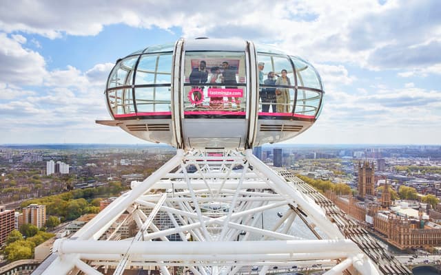 London Eye glass capsule at the top of the wheel with views over Parliament and the Thames