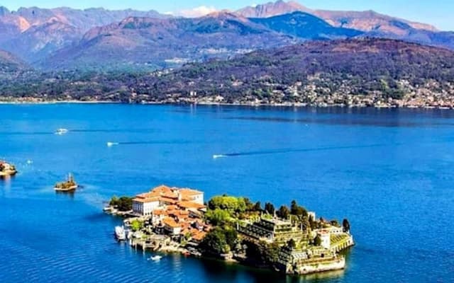 Aerial view of Isola Bella island on Lake Maggiore near Stresa with Alpine mountains behind