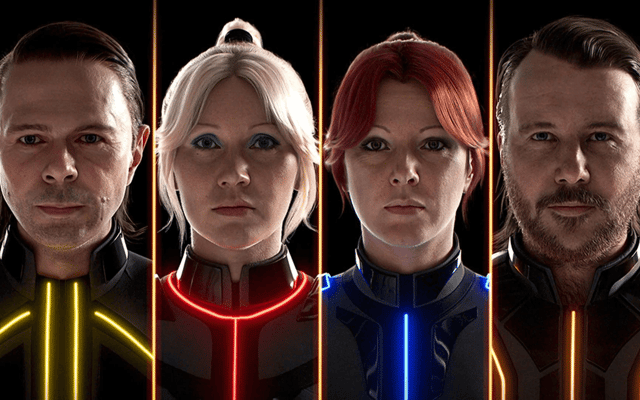 The four ABBA avatars in their illuminated Voyage costumes