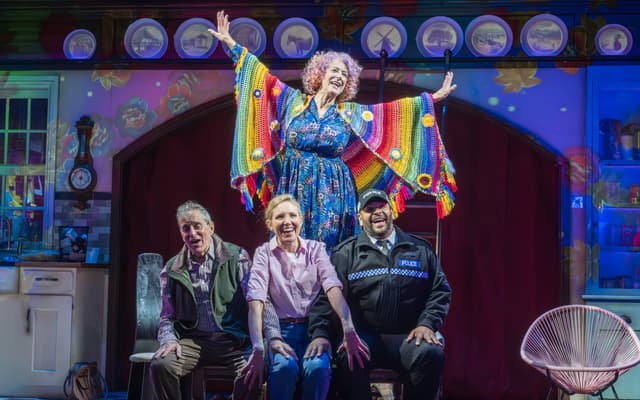 Dame Maureen Lipman in a rainbow cape with the cast of Allegra at the Harold Pinter Theatre