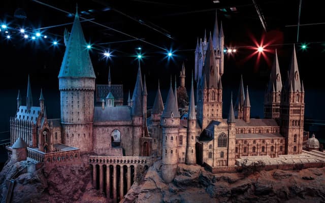 The giant 1:24 scale model of Hogwarts castle lit up at Warner Bros. Studio Tour London