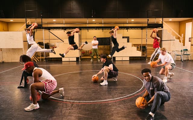 The company leaps with basketballs during a rehearsal for Disney's High School Musical