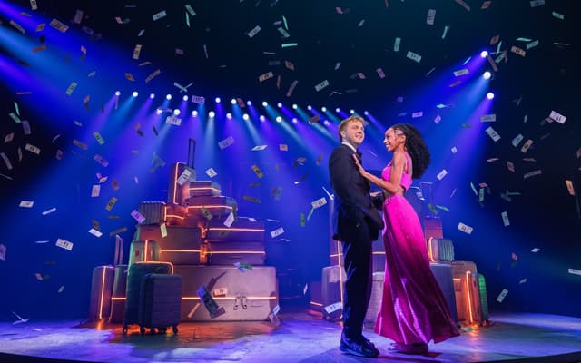 Sam Tutty and Christiani Pitts embrace amid falling confetti in Two Strangers (Carry a Cake Across New York)