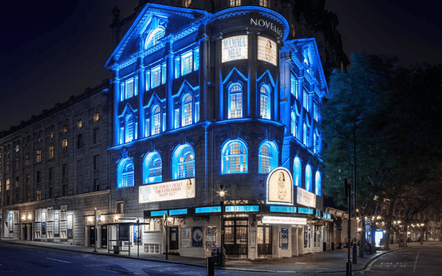 The Novello Theatre on the Aldwych lit up in blue at night