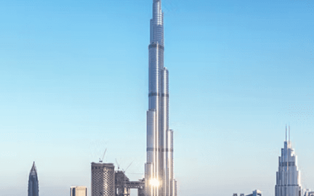 Burj Khalifa rising above the downtown Dubai skyline on a clear day, a backdrop for sky-high dining