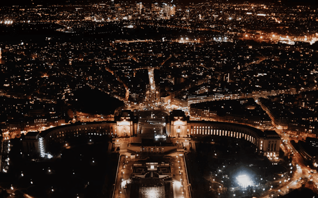 View of Paris at night from the top of the Eiffel Tower
