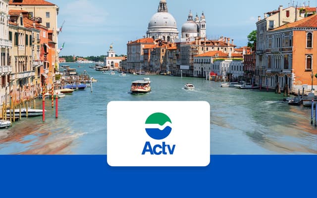 Grand Canal in Venice with vaporetto boats and the domes of Santa Maria della Salute basilica