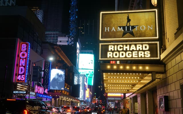 Hamilton marquee glowing at the Richard Rodgers Theatre on Broadway at night in New York