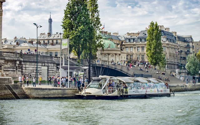Boats and the tree-lined quays along the River Seine in central Paris