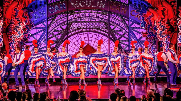 The red windmill on the facade of the Moulin Rouge cabaret in Paris