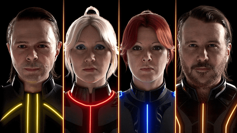 The four ABBA avatars in their illuminated Voyage costumes
