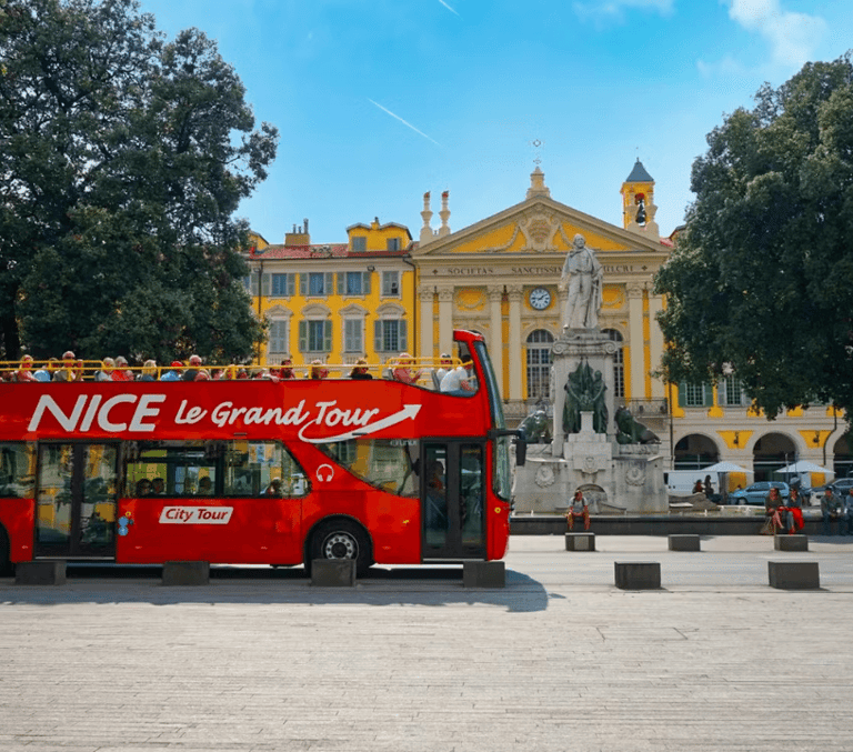 Red Nice Le Grand Tour open-top sightseeing bus parked by Place Garibaldi on the French Riviera