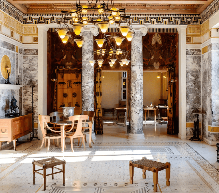 Ornate marble villa salon with columns and chandelier on the French Riviera