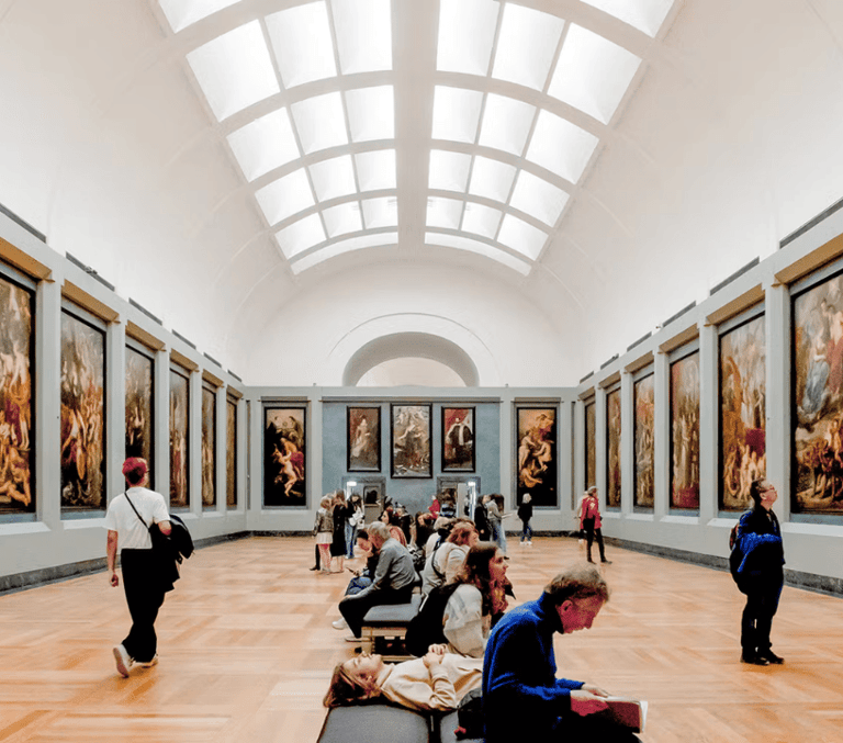 Skylit gallery of classical paintings inside the Louvre in Paris