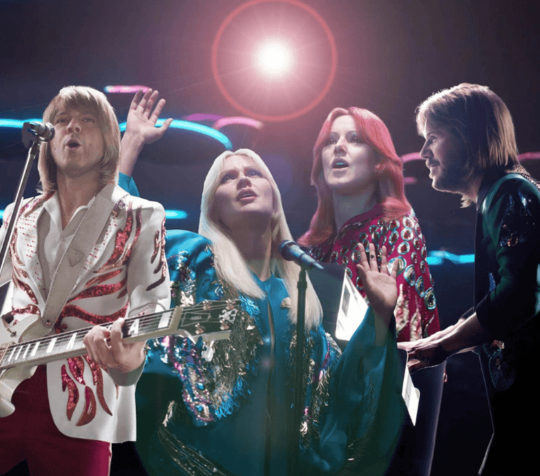 ABBA Voyage digital avatars performing on a glowing concert stage in London