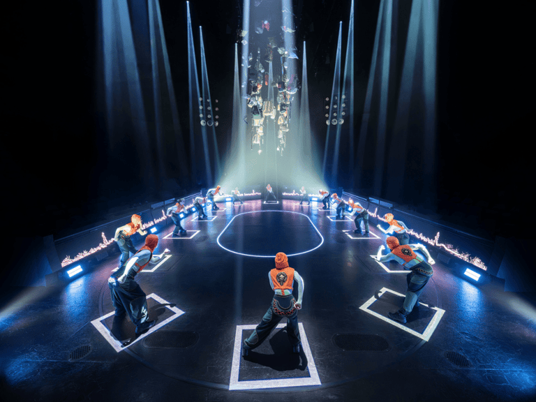 Tributes rise onto their starting plates in the arena in The Hunger Games On Stage