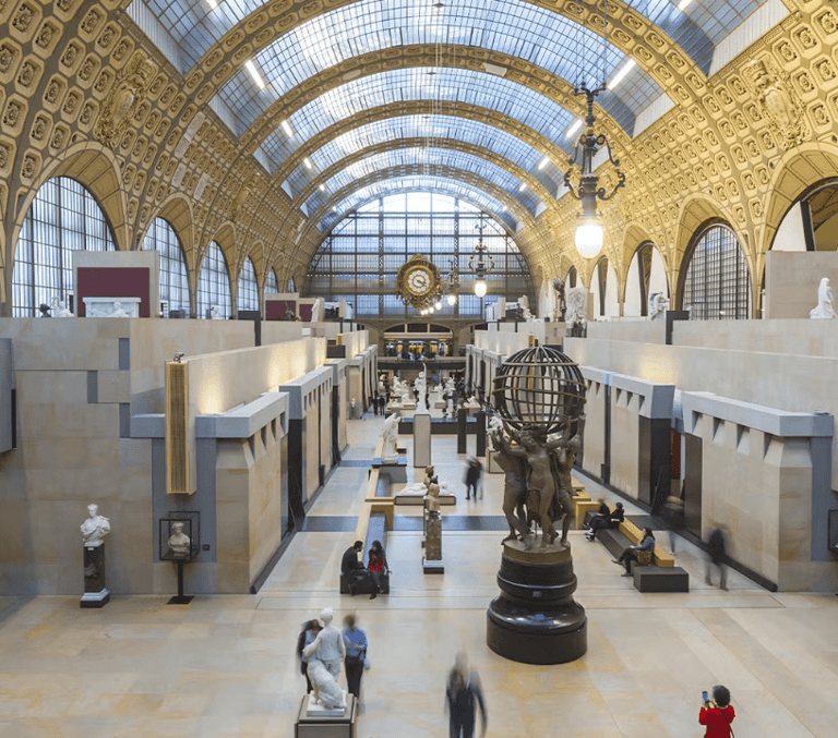 Musee d'Orsay grand hall with its arched glass ceiling and giant clock in Paris