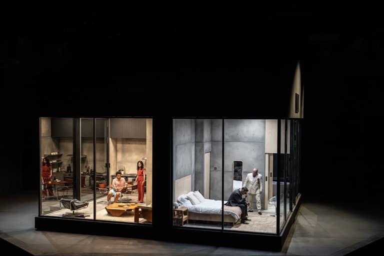 Archie Madekwe, Mary-Louise Parker, David Morrissey and Lloyd Hutchinson in the glass-walled set of The Oresteia at the Bridge Theatre