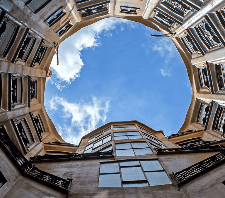 Casa Mila La Pedrera rooftop courtyard looking up at the sky in Barcelona