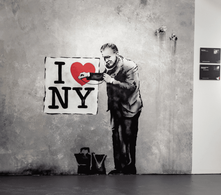 Banksy-style I Love NY mural of a doctor listening to a heart with a stethoscope
