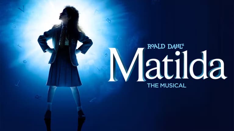 Matilda The Musical at the Cambridge Theatre with the cast on the desk-stack set