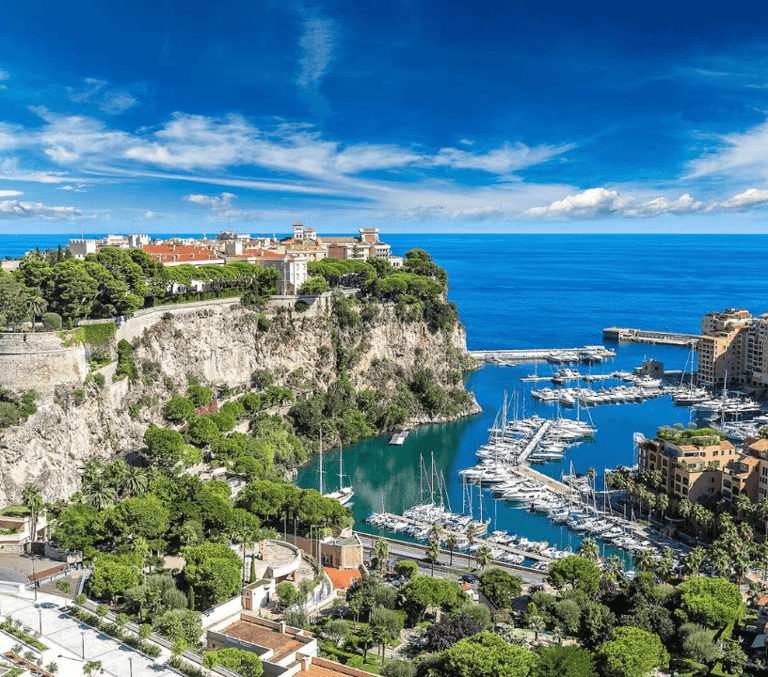 The Rock of Monaco old town and harbour marina above the blue Mediterranean Sea