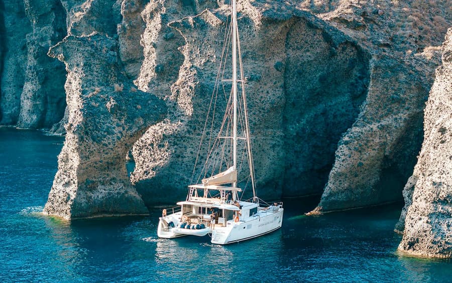 From Santorini: Luxury Catamaran Day Cruise with Lunch, Drinks & Transfers