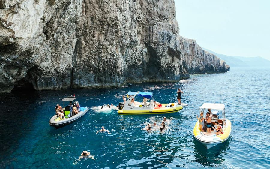 From Vlore: Unknown Escape Party Boat Cruise with Drinks, Music & Secret Swim Stops