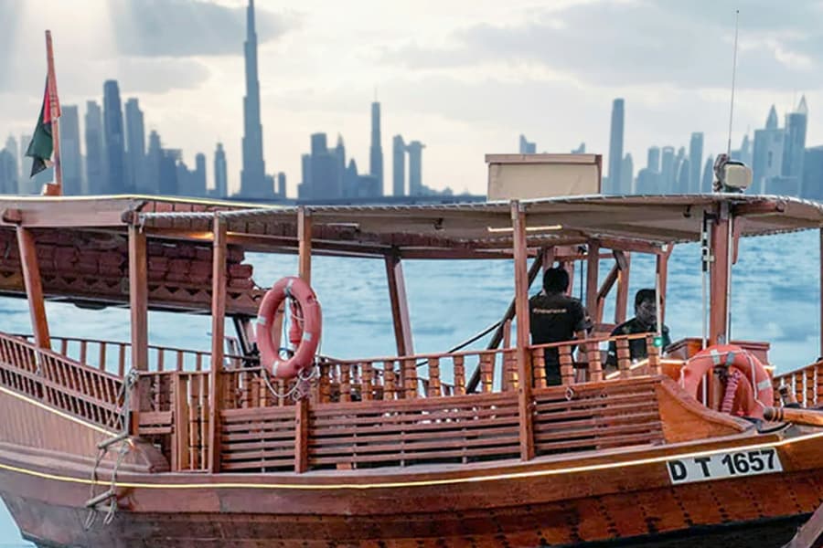 Dubai Canal: Sunset Abra Cruise with High Tea, at Dubai Sightseeing Cruises