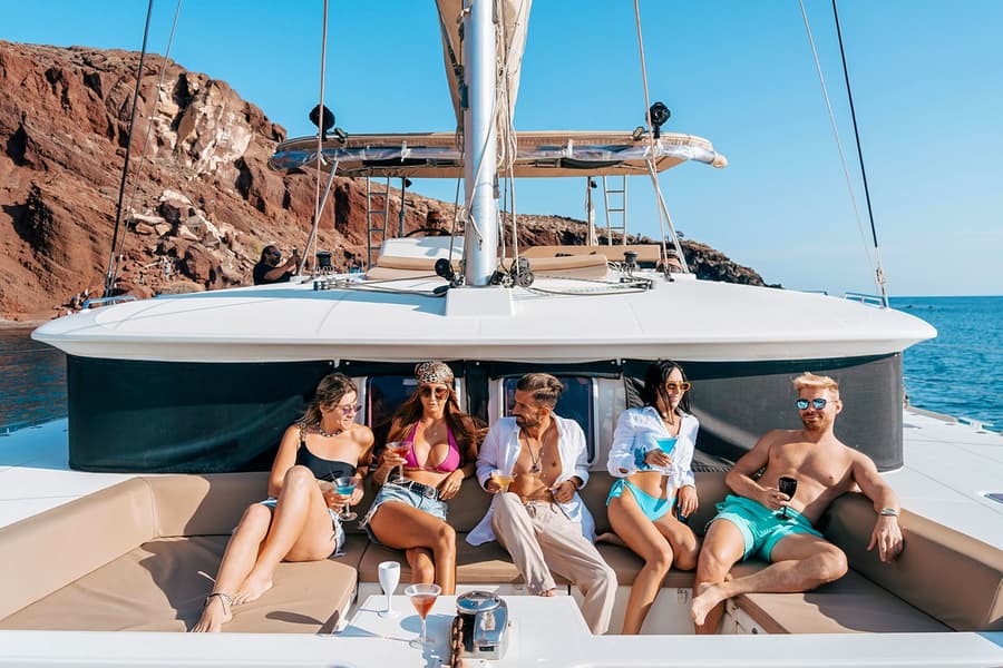 From Santorini: Classic Catamaran Cruise with Meal, Drinks & Transfers, at Fira