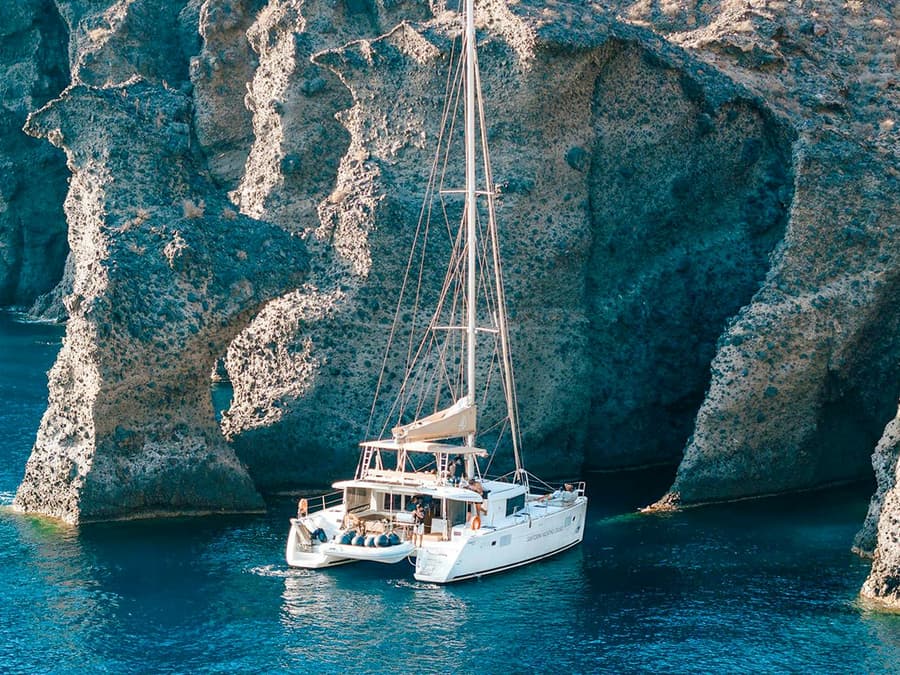 From Santorini: Luxury Catamaran Day Cruise with Lunch, Drinks & Transfers