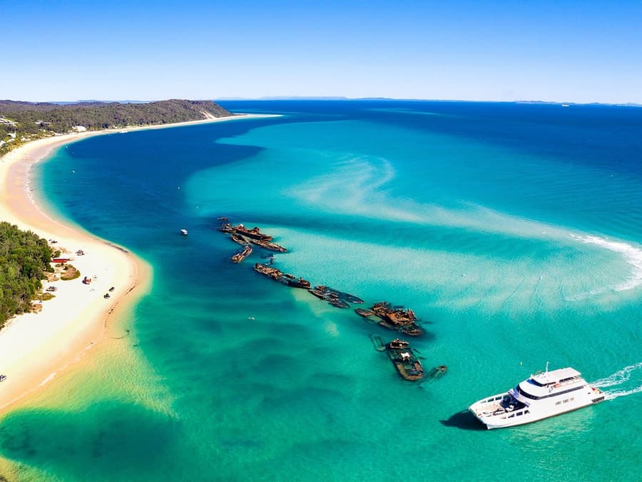 From Gold Coast: Tangalooma Wrecks Snorkel, Clear Kayak, & 4WD Desert Tour with Lunch