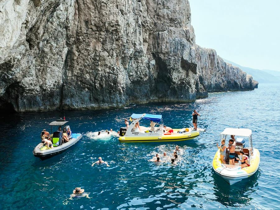 From Vlore: Unknown Escape Party Boat Cruise with Drinks, Music & Secret Swim Stops