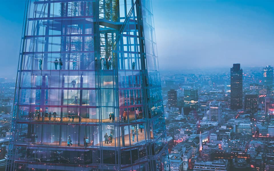 London skyline at golden hour from the Shard with the Thames curving past the City