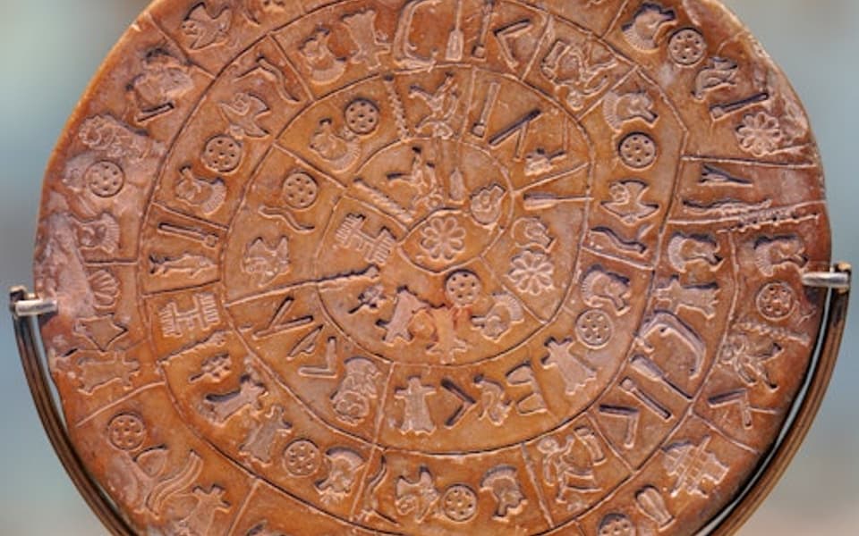 The Phaistos Disc with spiral hieroglyphic stamps at the Heraklion Archaeological Museum, Crete