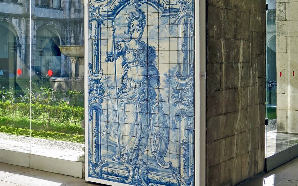 Blue and white azulejo tile panel of a warrior goddess at the National Tile Museum in Lisbon