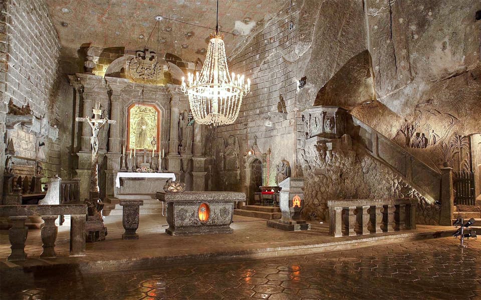 Underground salt chapel with chandelier and carved altar at Wieliczka near Krakow