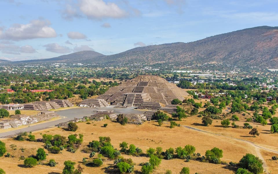 Teotihuacan Pyramid of the Moon and Avenue of the Dead with mountains near Mexico City