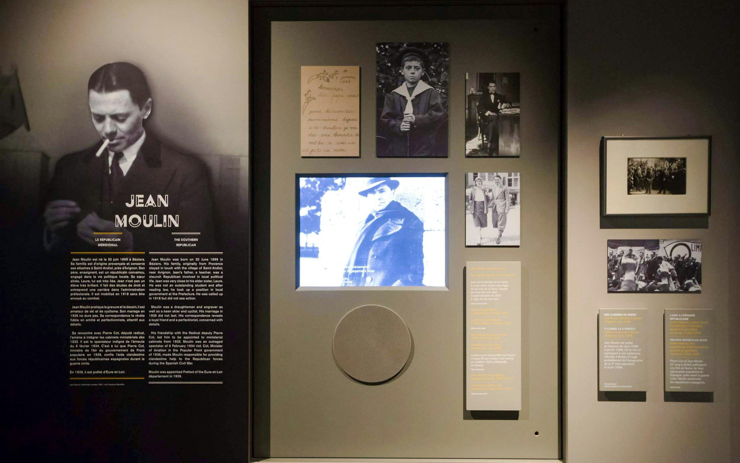 Jean Moulin exhibit at Liberation Museum, Paris, featuring historical photos and documents.
