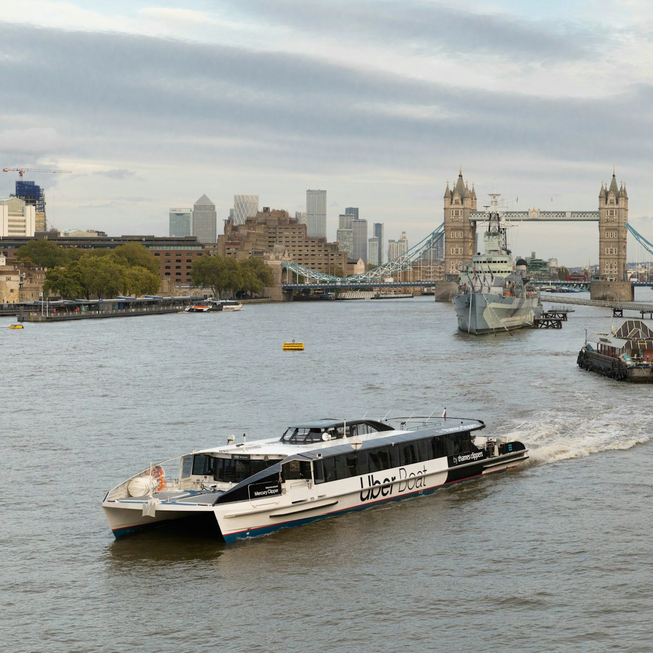 Uber Boat by Thames Clippers sailing near Tower Bridge