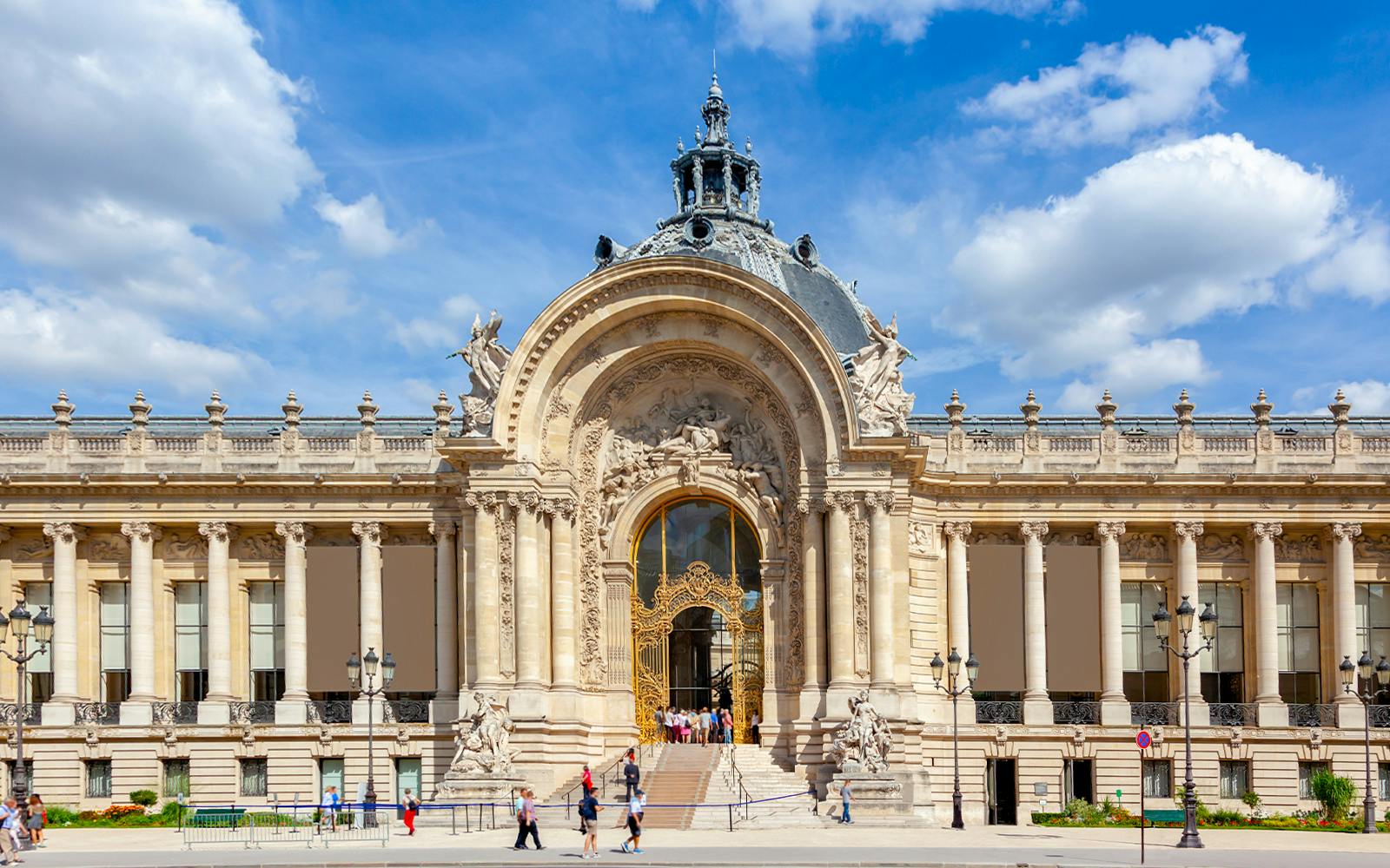 Ornate facade of Petit Palais in Paris with intricate architectural details.