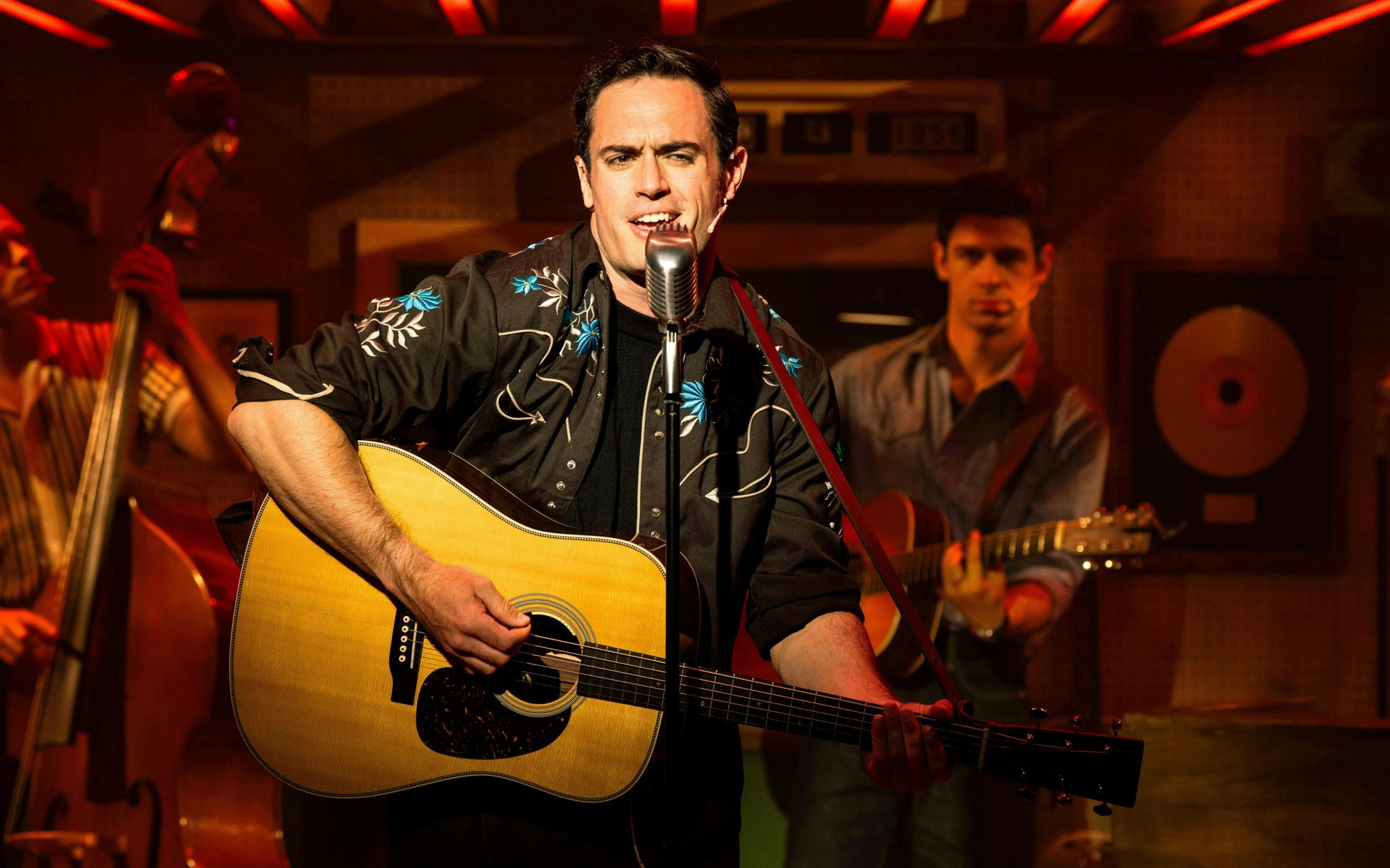 Johnny Cash with guitar in Million Dollar Quartet