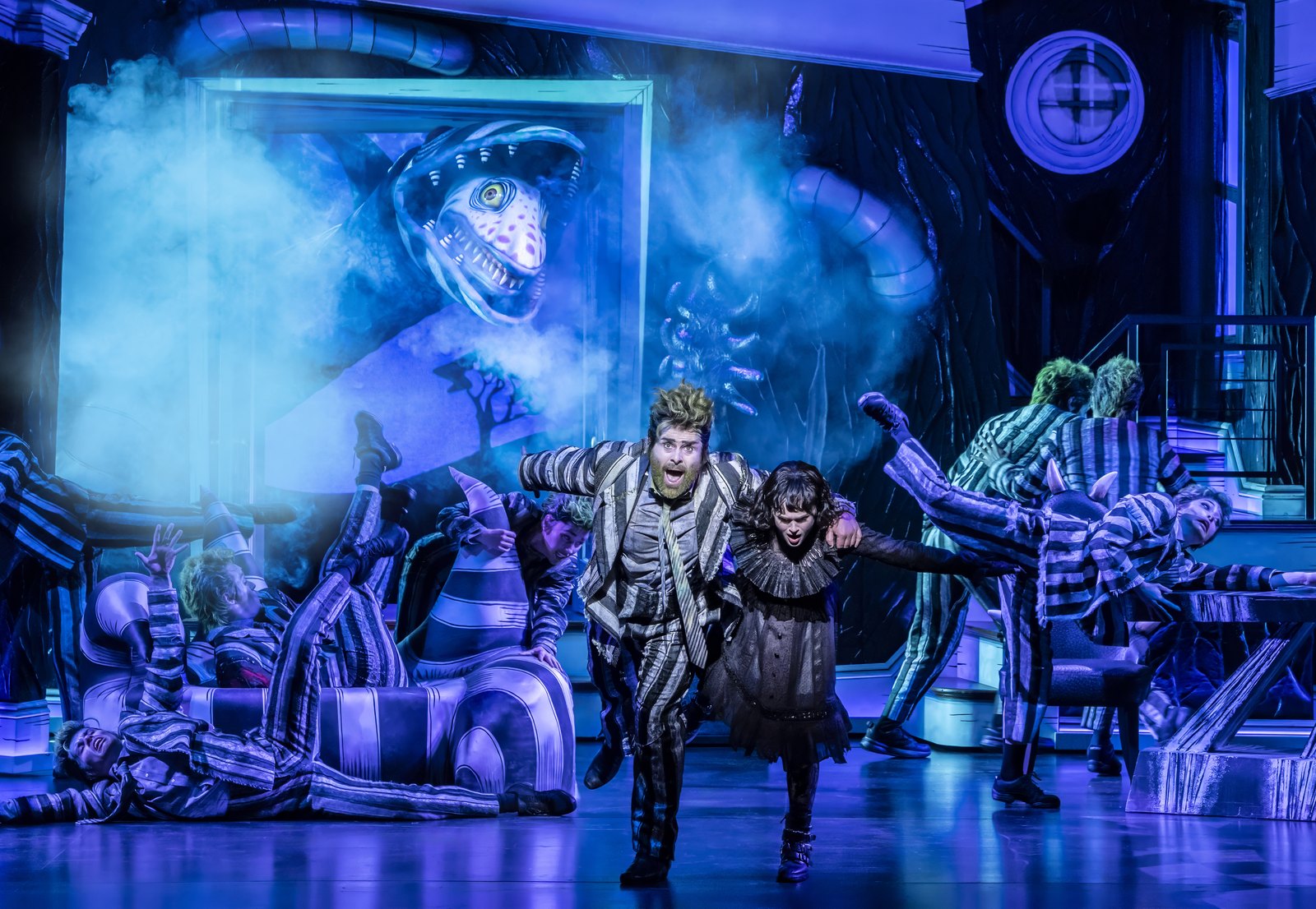 Beetlejuice and the sandworm in the West End production at the Prince Edward Theatre
